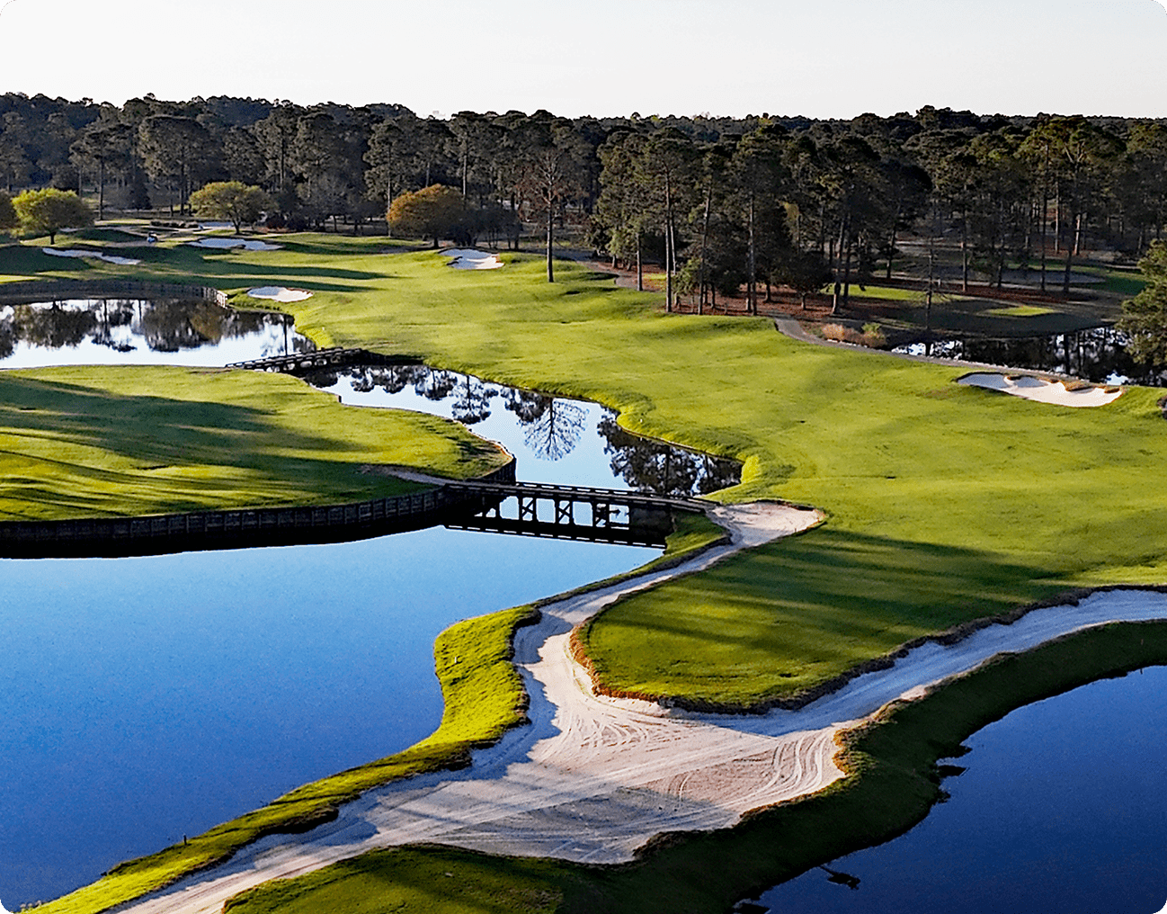 Scenic golf course with bridge over water